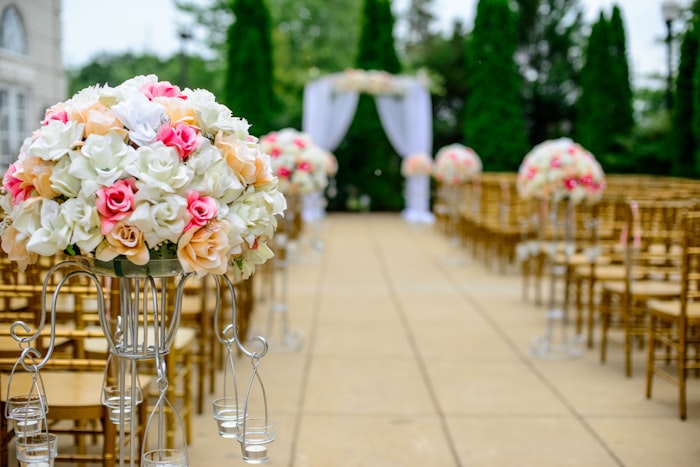 Outdoor evening reception with warm tent lighting