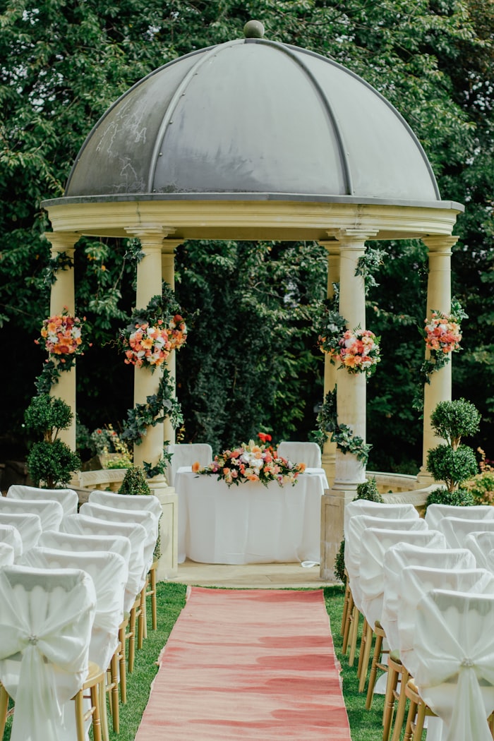 Round tables set under a tent for a celebration